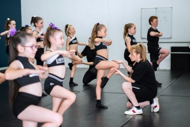 Students in a dance class at Simone's School of Performing Arts, embracing the latest dance trends and culture.