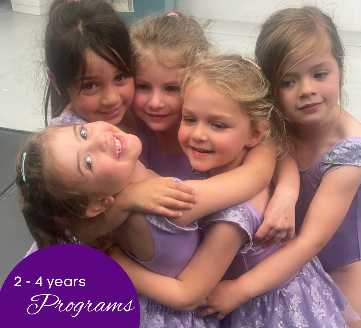 Kids aged 2-4 in dance classes at Simone's School of Performing Arts in Berkeley Vale, smiling and with arms around each other, enjoying preschool dance programs